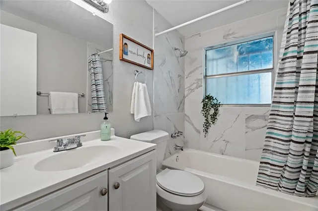 a bathroom with a sink a toilet and a bathtub