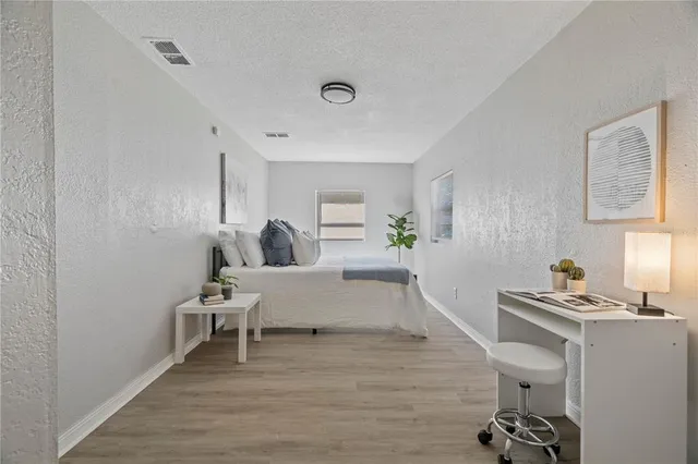 a bedroom with furniture and a window