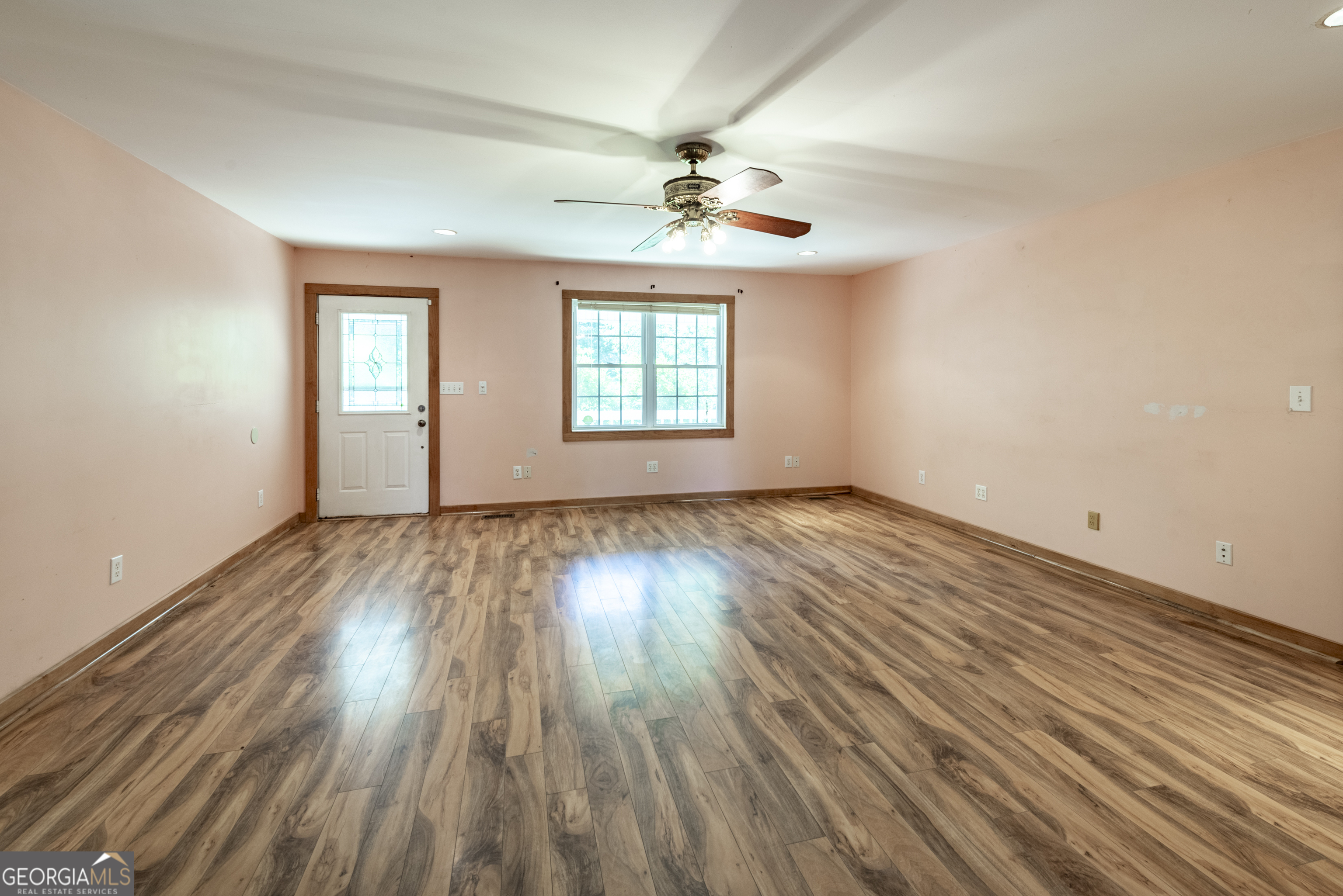 157 Edwards Road Fairmount, GA 30139 - Photo 19 of 72 an empty room with wooden floor chandelier fan and windows