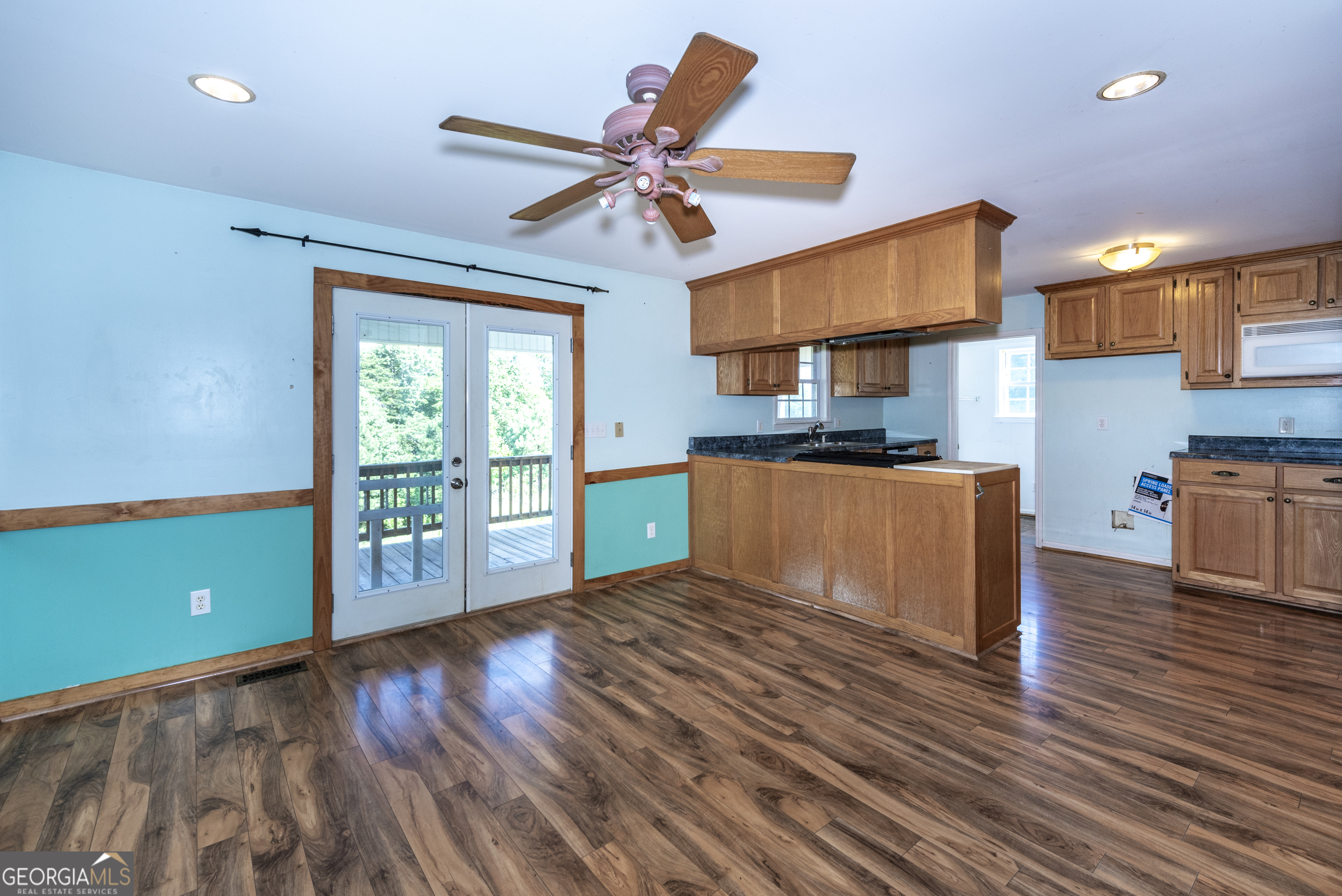 157 Edwards Road Fairmount, GA 30139 - Photo 24 of 72 a kitchen with stainless steel appliances granite countertop a stove top oven a sink and a microwave