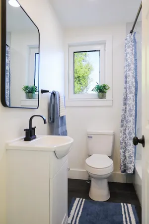 a bathroom with a toilet and a sink