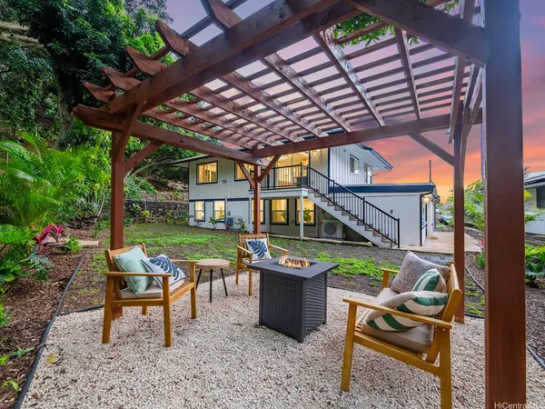 a view of a chairs and table in a patio