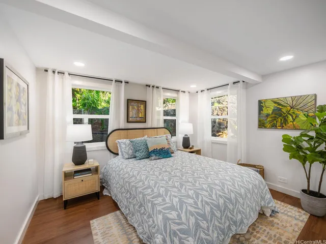 a bedroom with a large bed and a couch