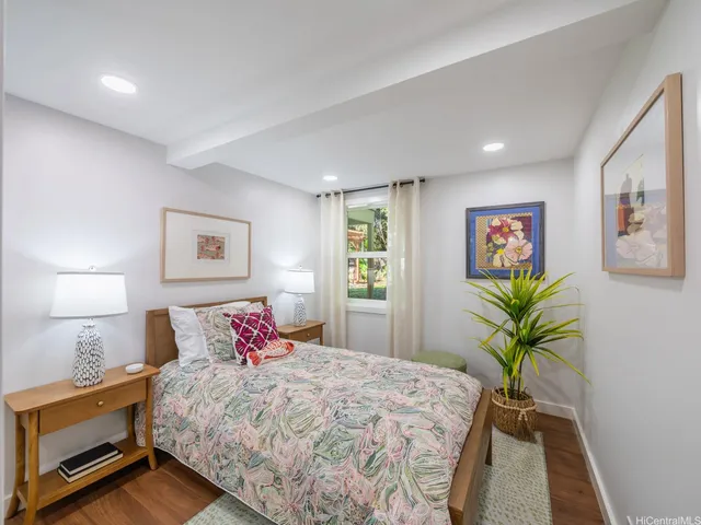 a bedroom with a bed and a lamp