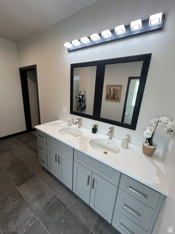 160 200 West Henefer, UT 84033 - Photo 15 of 25 Dual vanity with a white countertop and undermount sinks, light gray cabinetry, and brushed nickel hardware