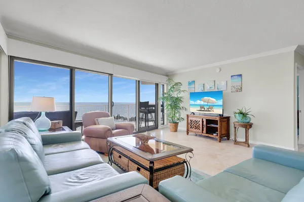 a living room with furniture flat screen tv and a fireplace