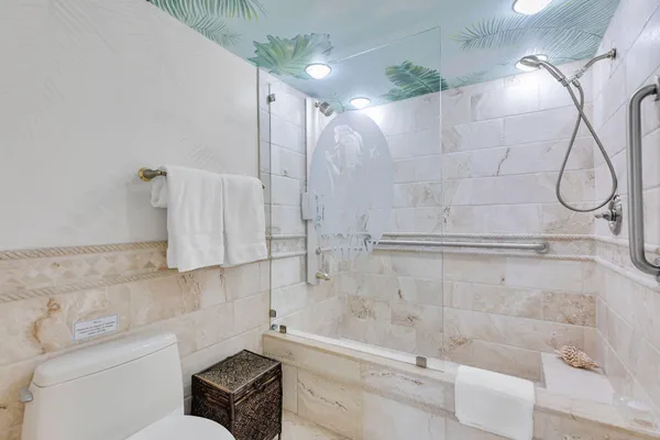 a bathroom with a bathtub and a shower