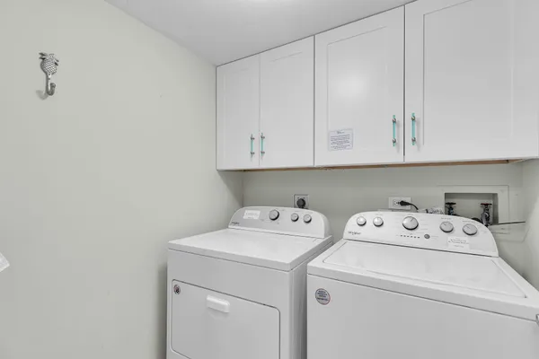 a view of storage and utility room with washer and dryer