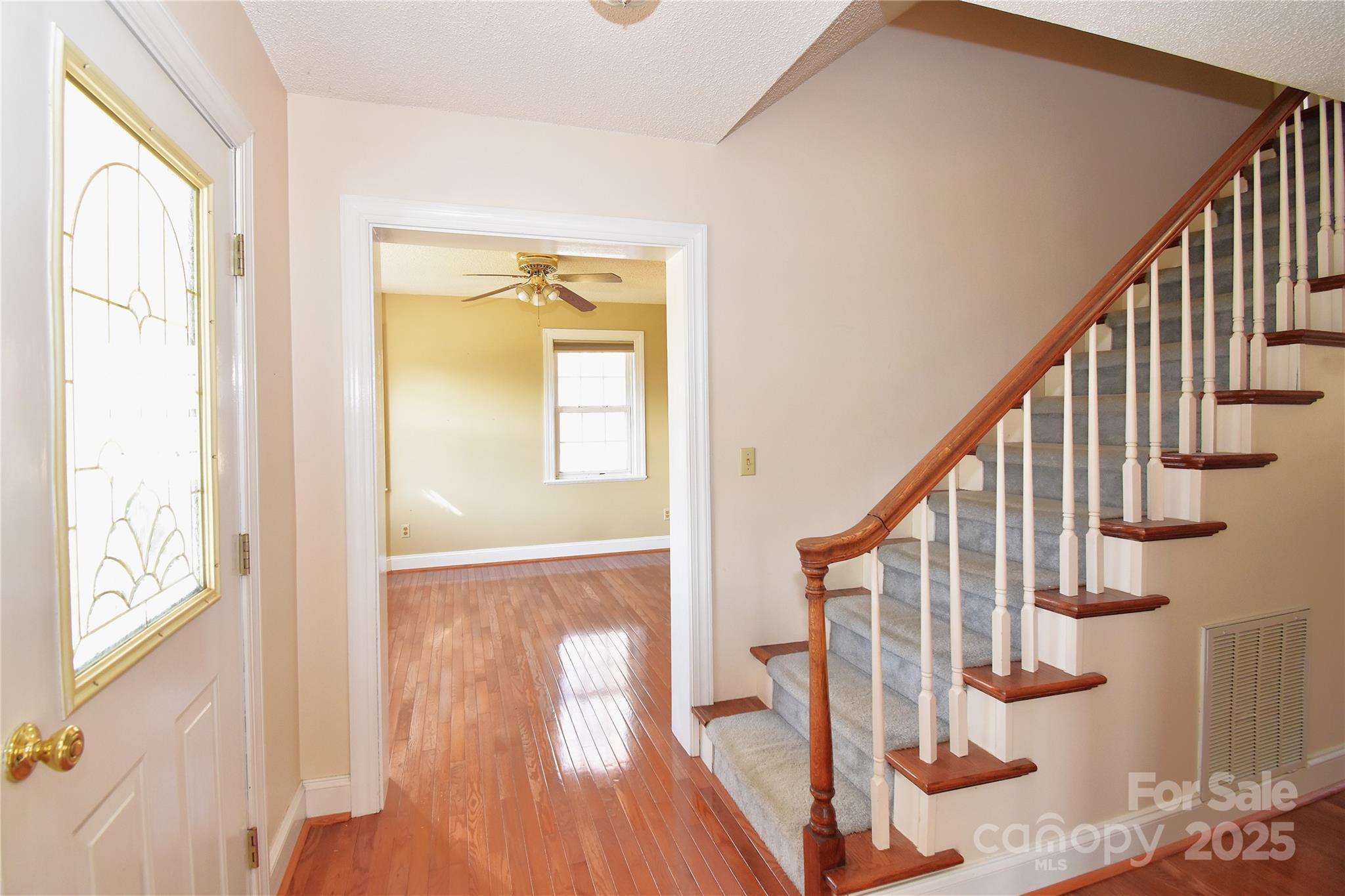 233 Ledbetter Road Arden, NC 28704 - Photo 14 of 45 a view of staircase with wooden floor and floors