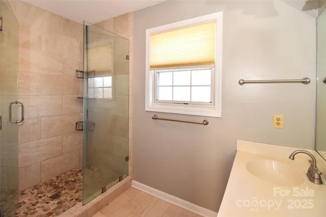 a bathroom with a tub and shower