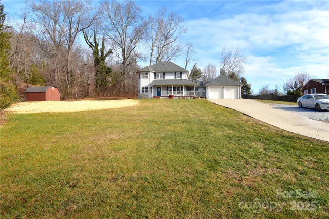 a yellow building with trees in front of it
