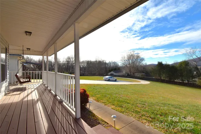 a view of a swimming pool with a porch