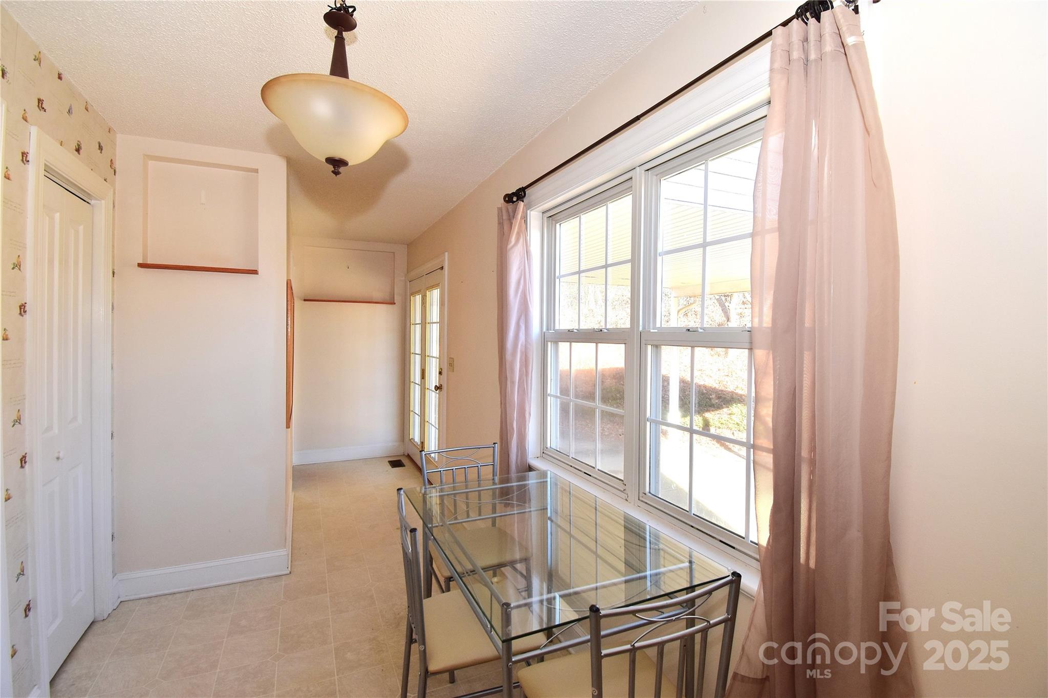 233 Ledbetter Road Arden, NC 28704 - Photo 8 of 45 a view of a room with furniture and windows