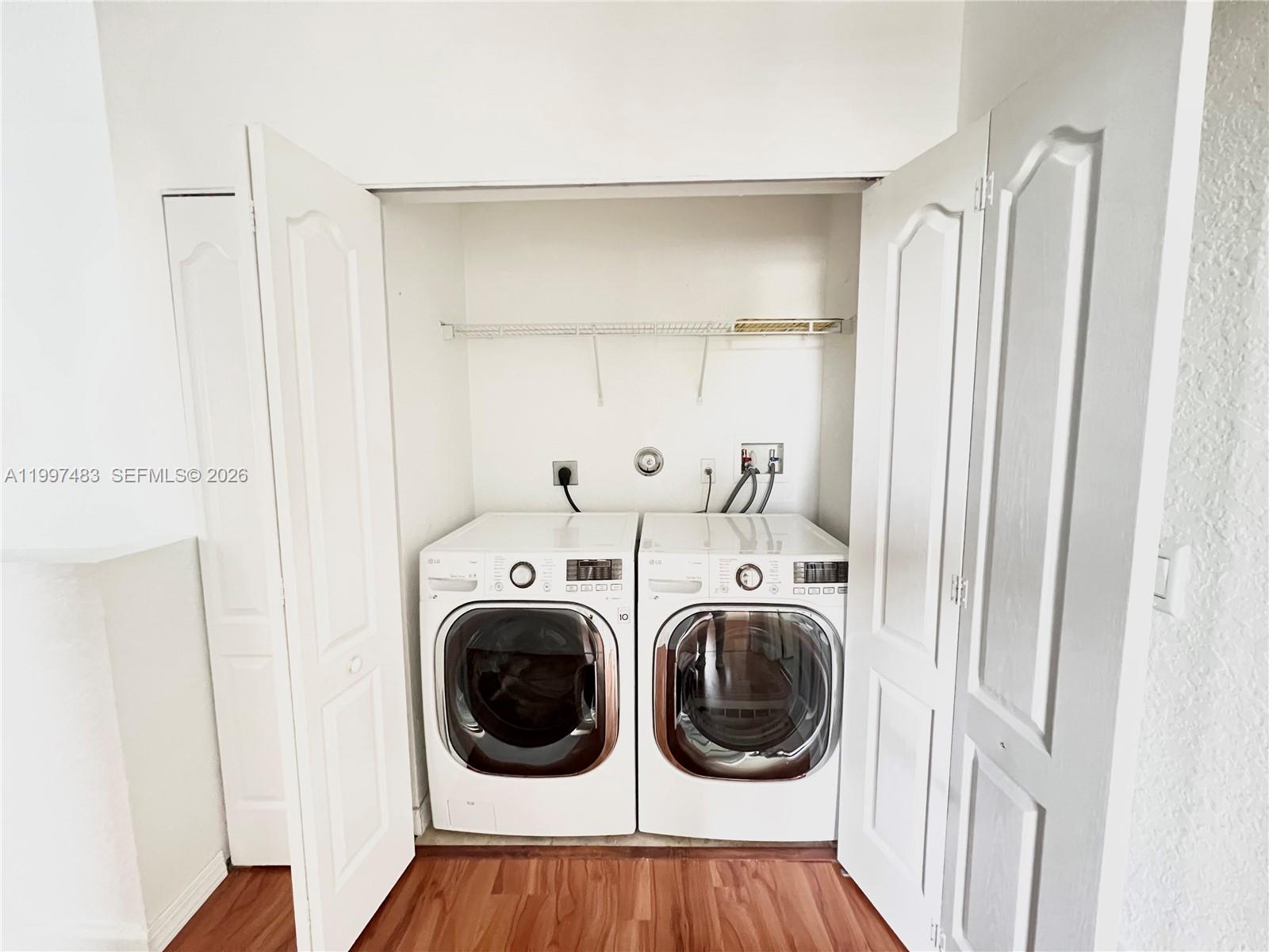 3910 Northeast 13th Drive Homestead, FL 33033 - Photo 15 of 35 a view of a hallway with washer and dryer