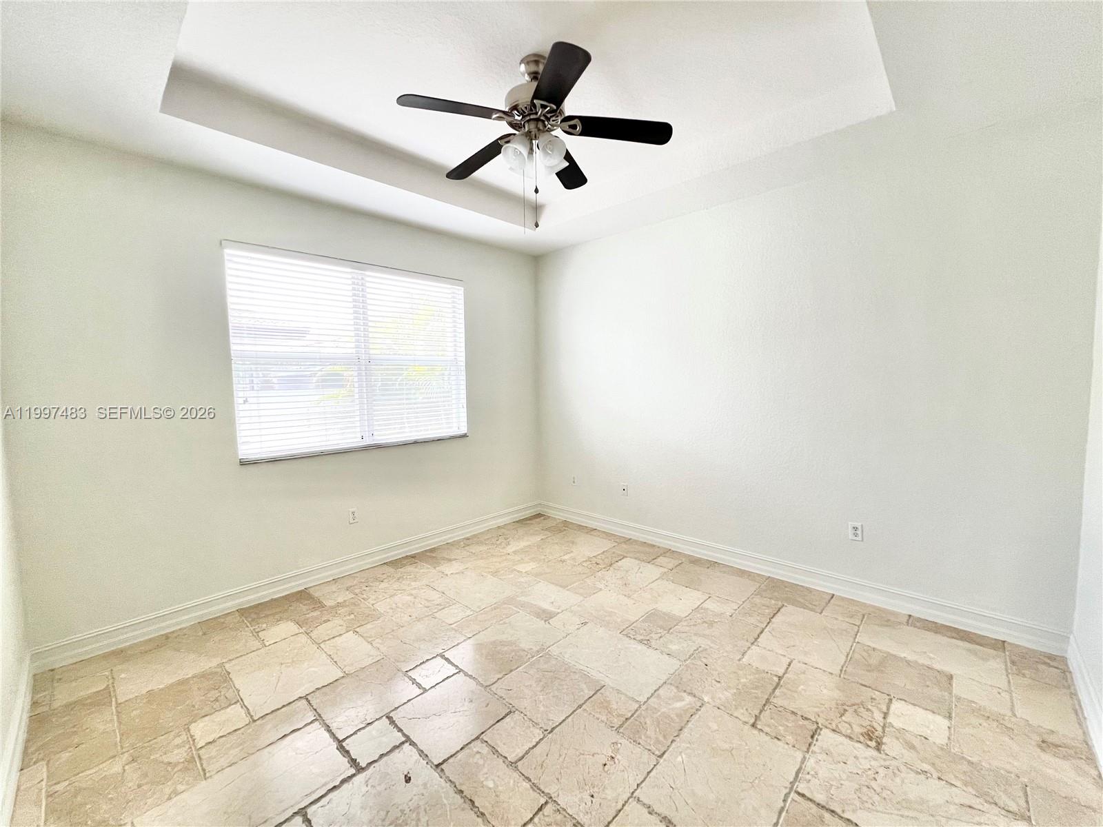 3910 Northeast 13th Drive Homestead, FL 33033 - Photo 23 of 35 an empty room with wooden floor and windows
