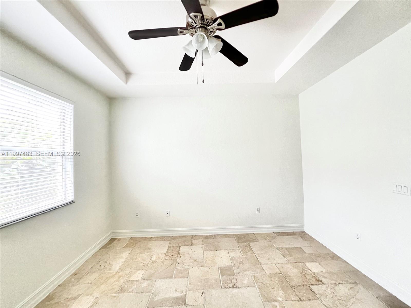 3910 Northeast 13th Drive Homestead, FL 33033 - Photo 24 of 35 an empty room with a window and a fan