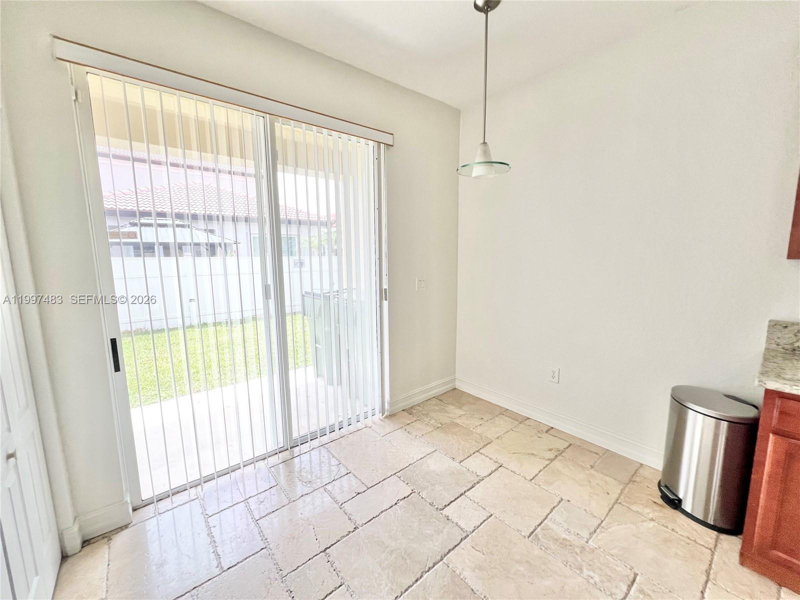 3910 Northeast 13th Drive Homestead, FL 33033 - Photo 26 of 35 a view of an empty room with a window