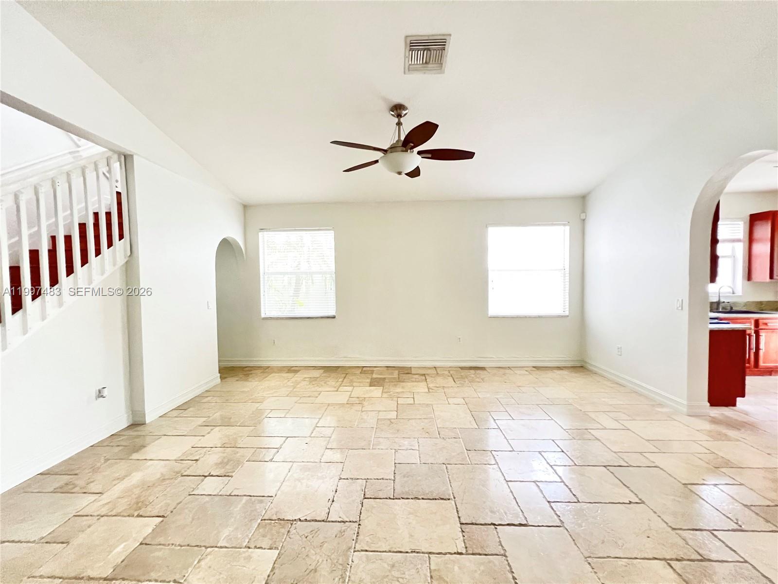 3910 Northeast 13th Drive Homestead, FL 33033 - Photo 28 of 35 a view of a livingroom with a staircase