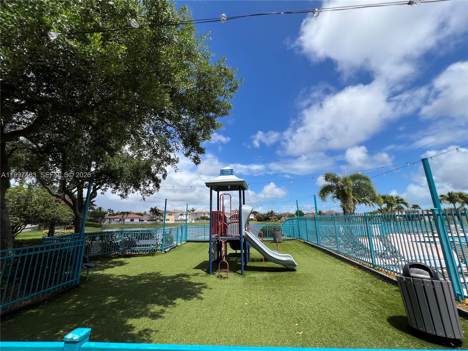 3910 Northeast 13th Drive Homestead, FL 33033 - Photo 33 of 35 a view of a park with slide
