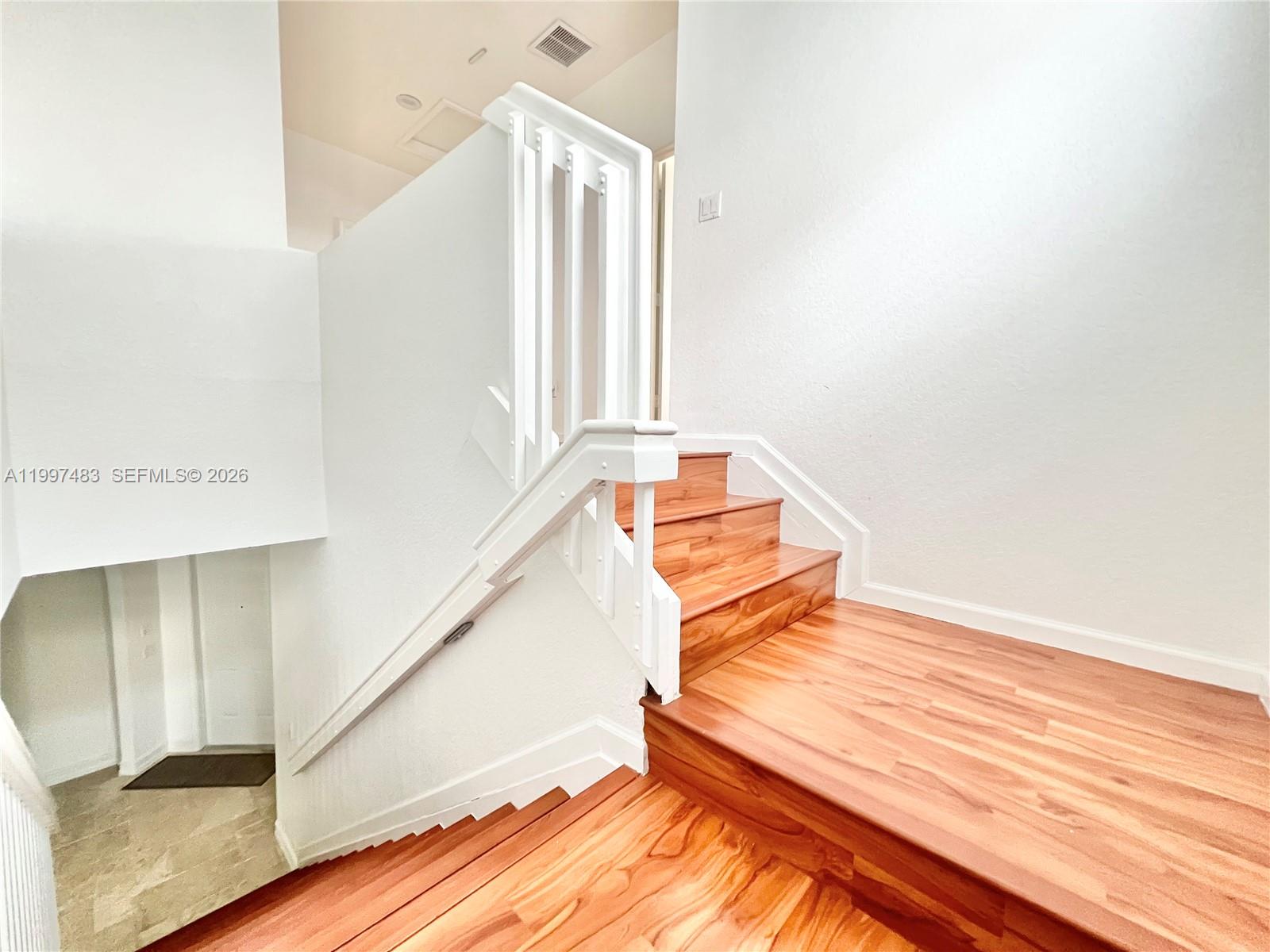 3910 Northeast 13th Drive Homestead, FL 33033 - Photo 7 of 35 a view of an empty room with stairs