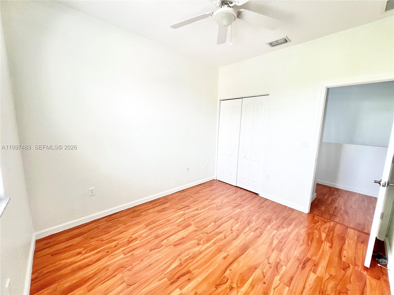 3910 Northeast 13th Drive Homestead, FL 33033 - Photo 10 of 35 a view of empty room with wooden floor