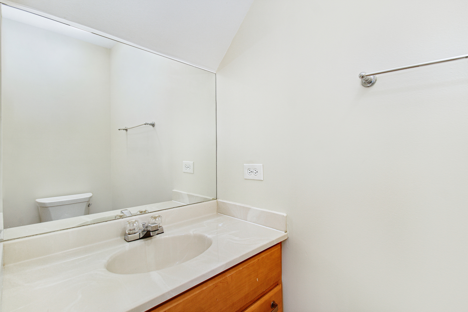 1334 South Lorraine Road, Unit F Wheaton, IL 60189 - Photo 7 of 12 a bathroom with a sink and a mirror