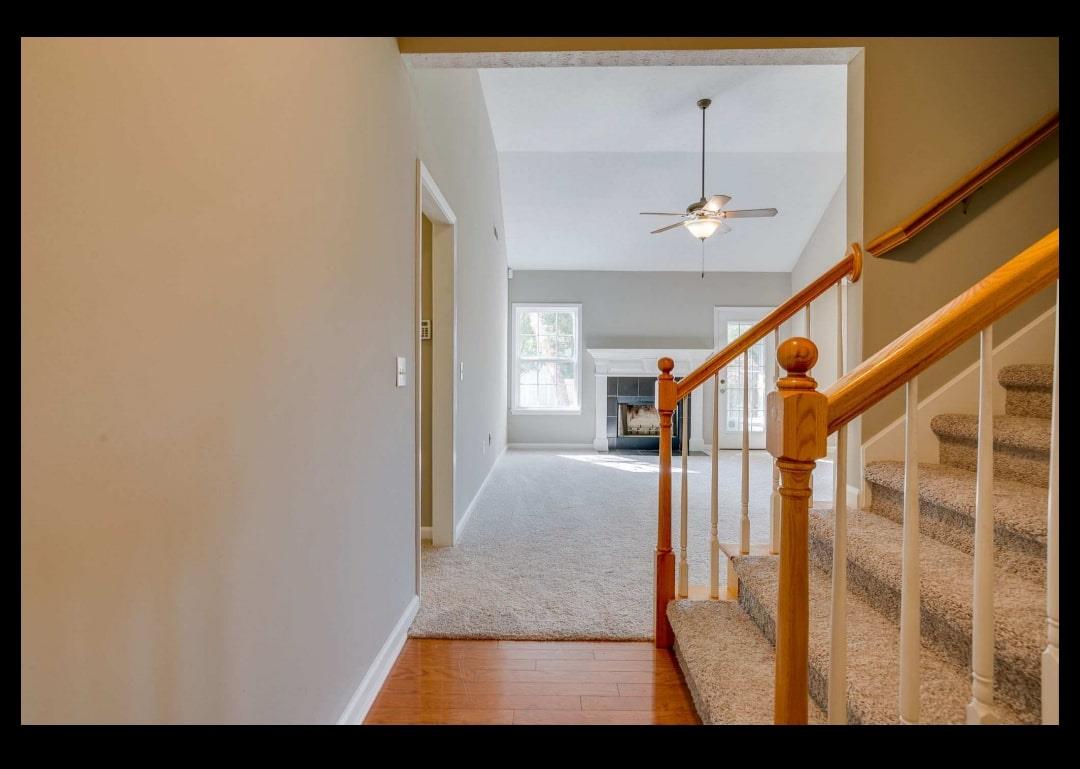 Entry into living room with fireplace