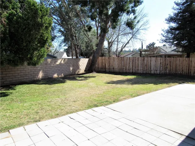 a view of a backyard of the house