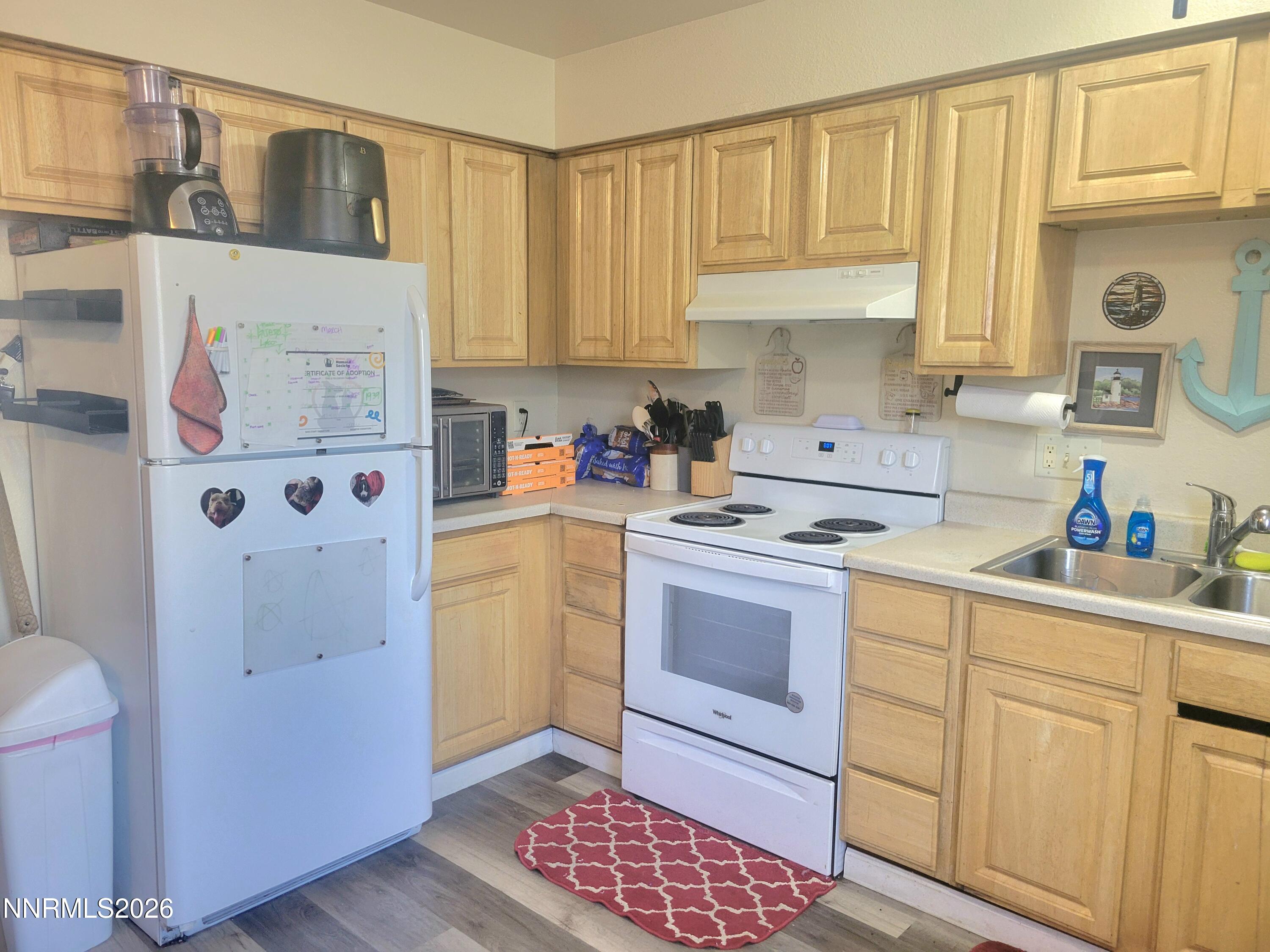 1404 East 9th Street, Unit 3 Reno, NV 89512 - Photo 8 of 29 a kitchen with a sink cabinets and window