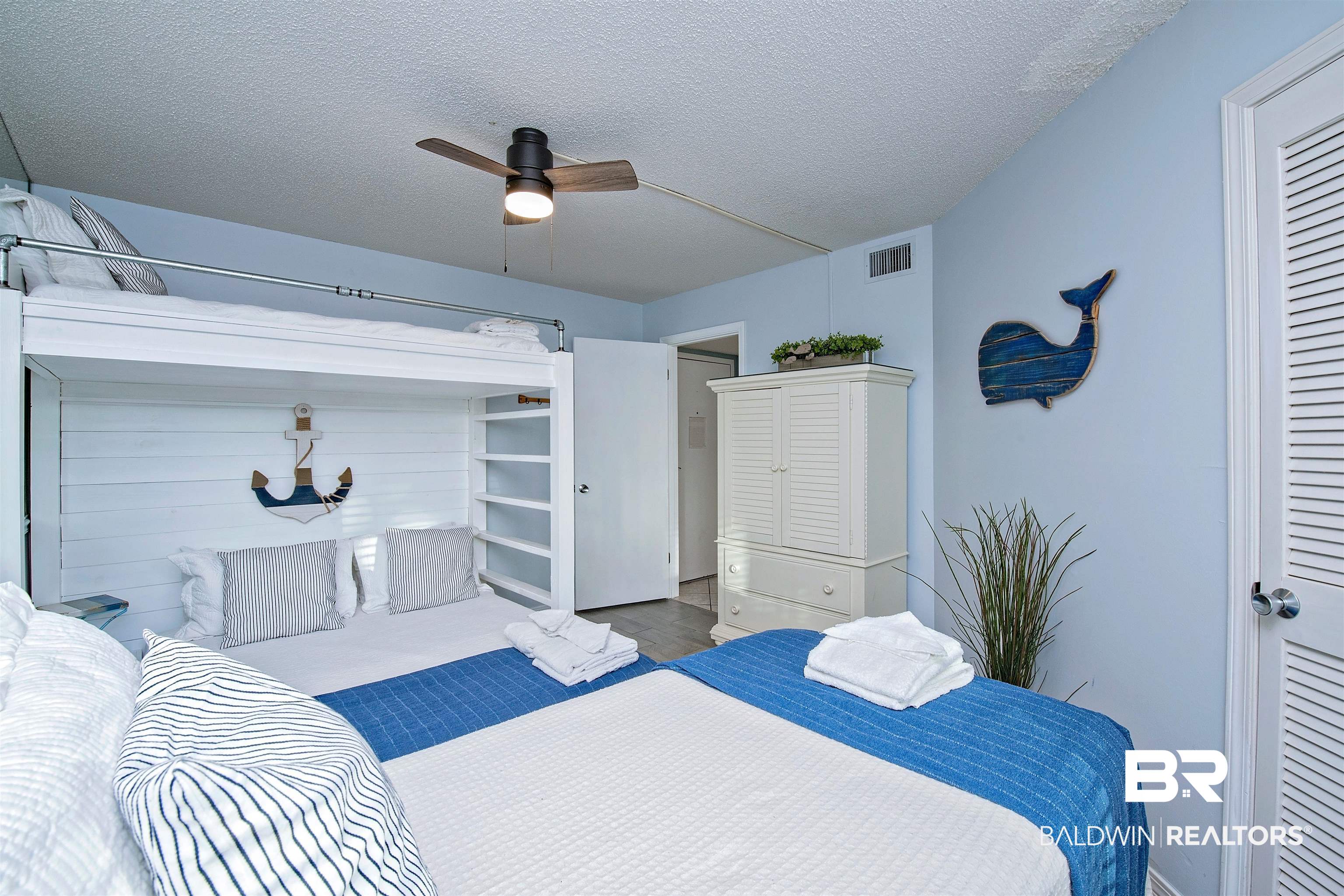 497 Plantation Road, Unit 1156 Gulf Shores, AL 36542 - Photo 17 of 28 Bedroom featuring ceiling fan and a textured ceiling