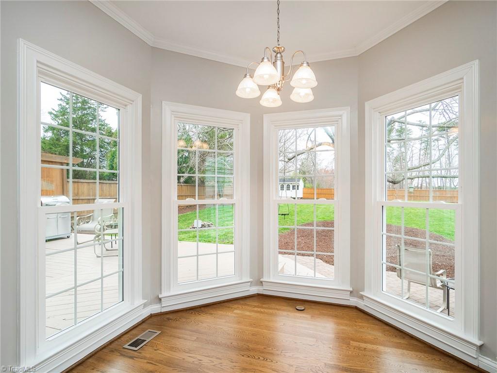 2811 Norwell Court Oak Ridge, NC 27310 - Photo 16 of 50 The natural light in the breakfast area through these new Pella windows illuminates the room while allowing views from every angle of the backyard.