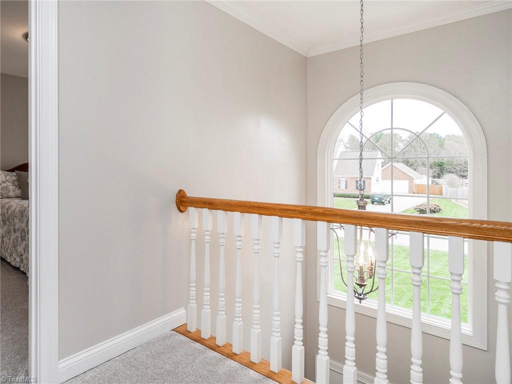 2811 Norwell Court Oak Ridge, NC 27310 - Photo 22 of 50 The two-story foyer showcases the palladium window, which floods the second floor landing with natural light.