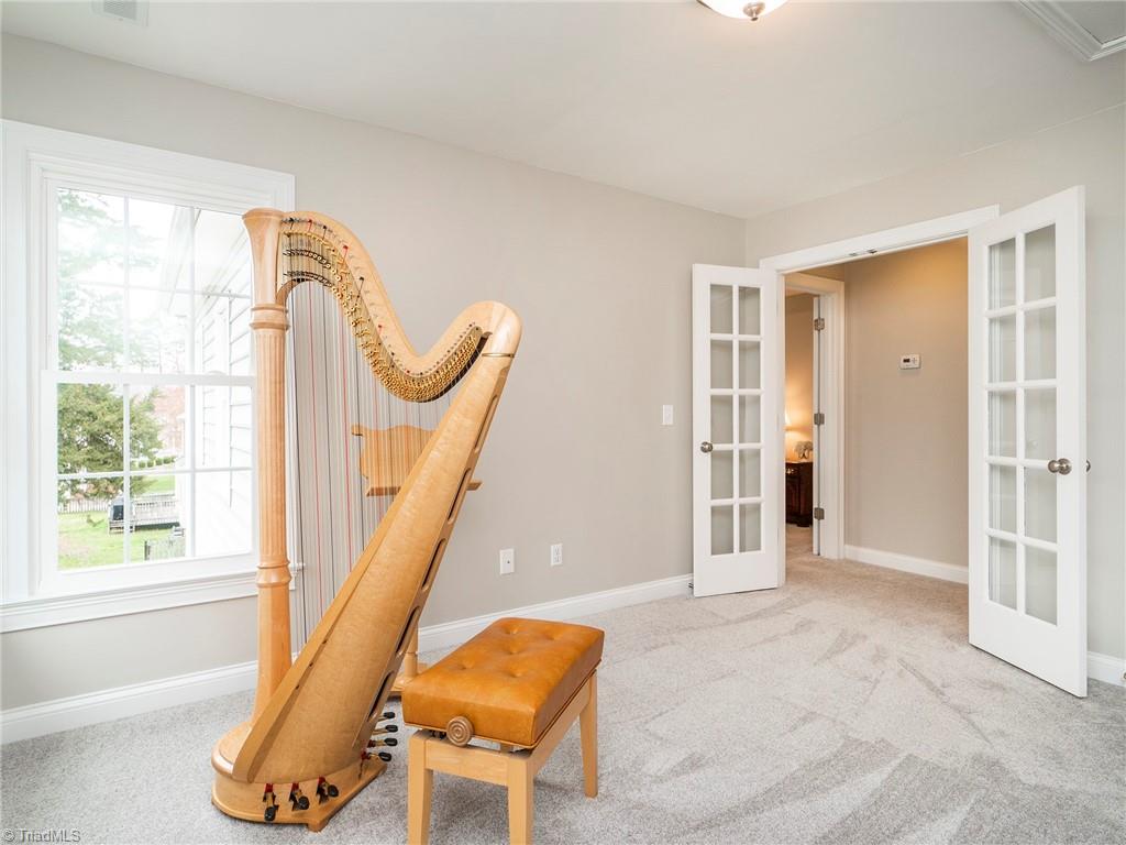 2811 Norwell Court Oak Ridge, NC 27310 - Photo 27 of 50 Bonus room on 2nd, would also make a great office or school room. Great natural light with views of tranquil backyard.