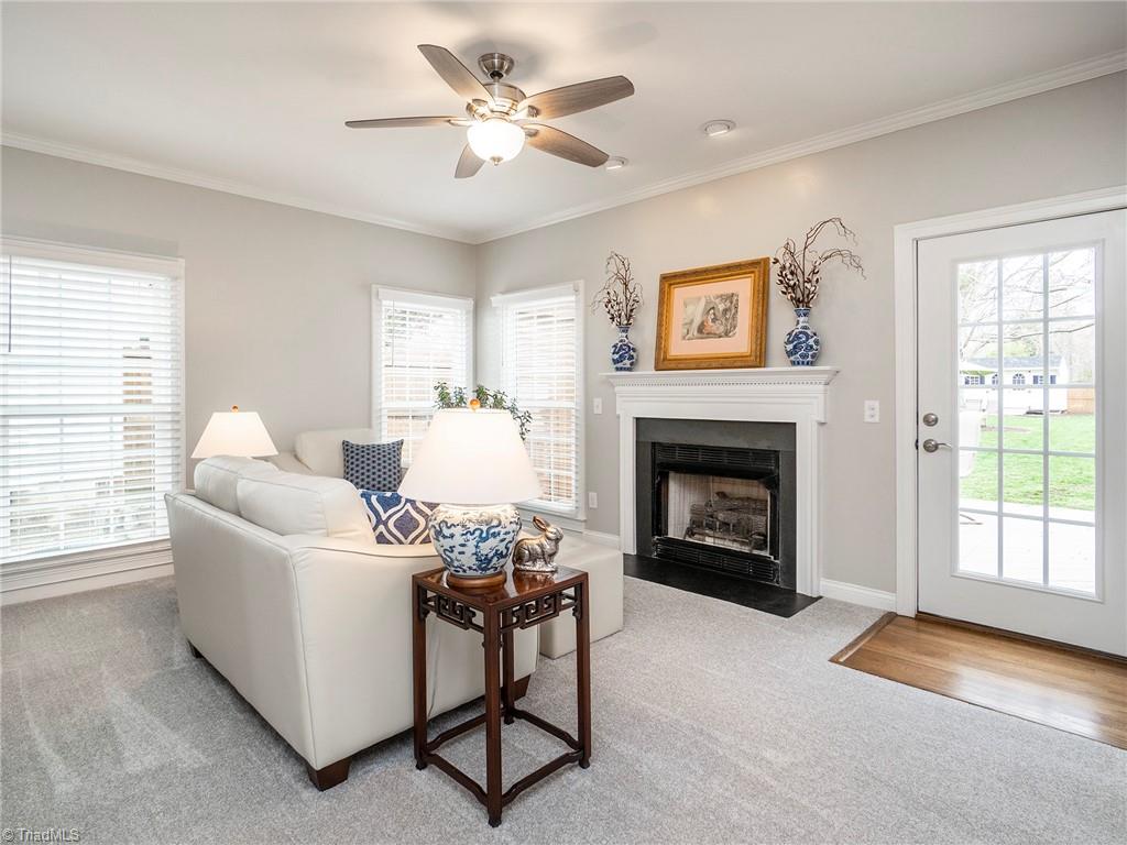 2811 Norwell Court Oak Ridge, NC 27310 - Photo 4 of 50 Family room with amazing natural light, gas log fireplace, brand new carpet and pella windows.