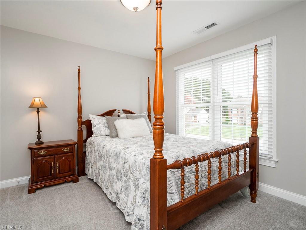 2811 Norwell Court Oak Ridge, NC 27310 - Photo 31 of 50 3rd bedroom with views of the front yard. Brand new carpets and pella window.