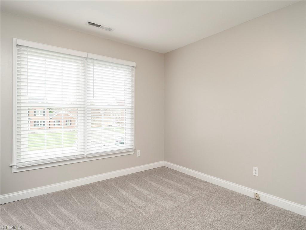 2811 Norwell Court Oak Ridge, NC 27310 - Photo 32 of 50 4th bedroom with views of the front yard, brand new carpet!