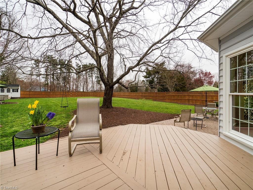 2811 Norwell Court Oak Ridge, NC 27310 - Photo 35 of 50 View of this tranquil backyard, it has been fenced for privacy with a 10x14 storage building.