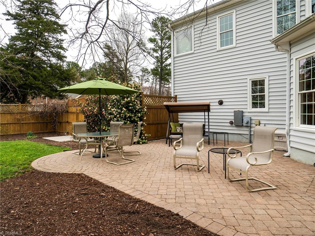 2811 Norwell Court Oak Ridge, NC 27310 - Photo 37 of 50 Extremely spacious custom 22x23 paver patio with multiple shared seating area perfect for entertaining.