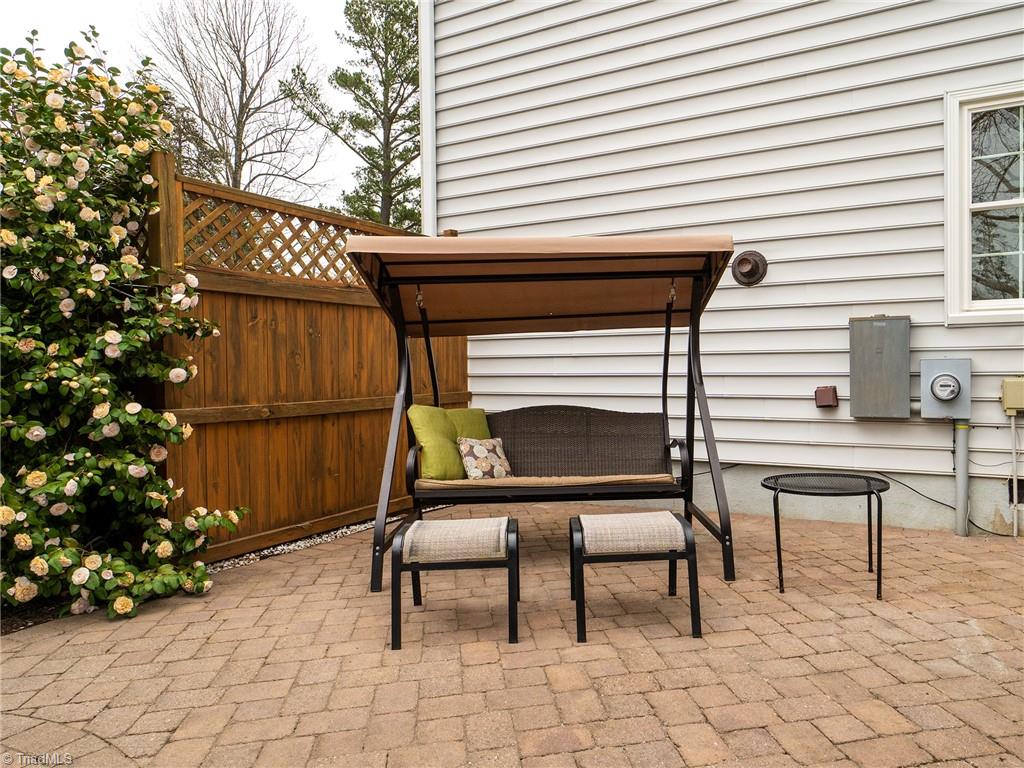 2811 Norwell Court Oak Ridge, NC 27310 - Photo 38 of 50 Tranquility at it's finest. The patio offers a private area to relax outsight of the neighbors with gorgeous landscaping