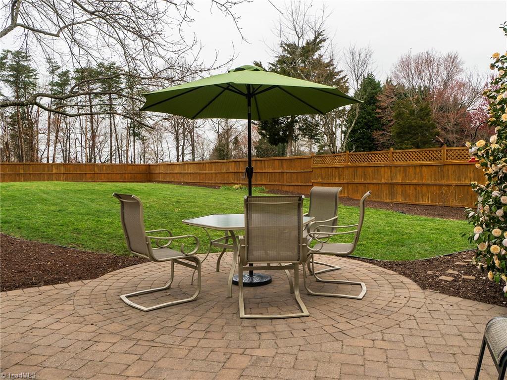 2811 Norwell Court Oak Ridge, NC 27310 - Photo 39 of 50 The details this home has to offer! The patio is laid in beautiful designs and patterns. Offering the perfect spot for a table and charis.