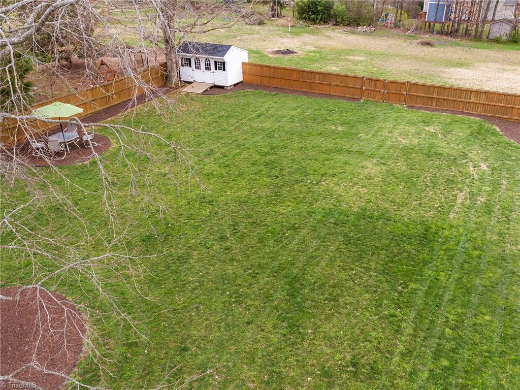2811 Norwell Court Oak Ridge, NC 27310 - Photo 46 of 50 Another view of the large flat backyard. Backyard does extend past the fence line.