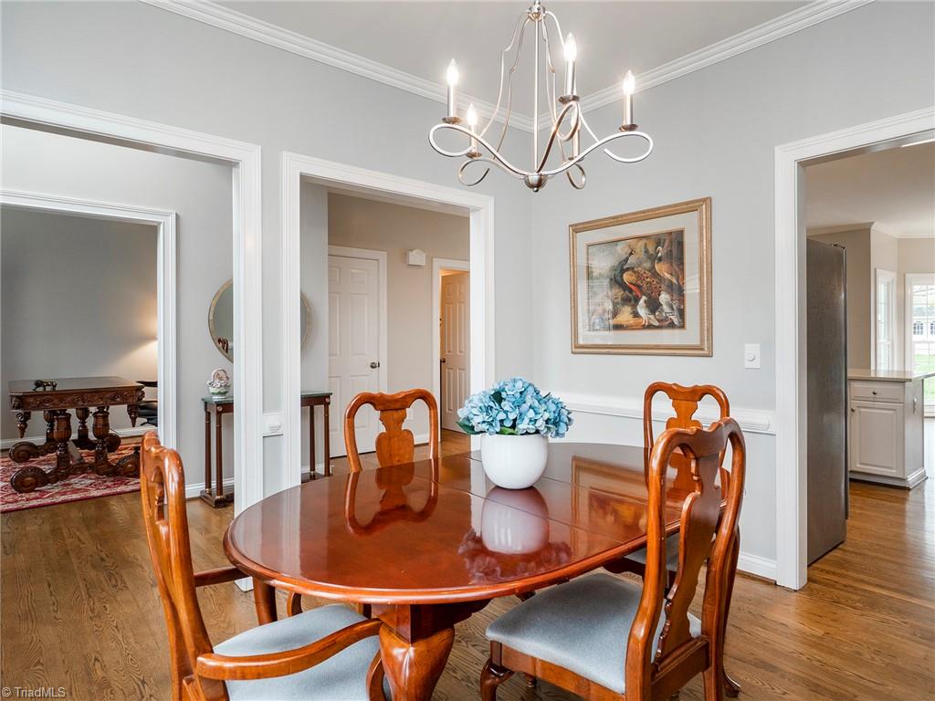 2811 Norwell Court Oak Ridge, NC 27310 - Photo 9 of 50 Dining Room can easily accomadate a full sized table along with a china cabinet/buffet and is open to entry way, with access directly into kitchen.