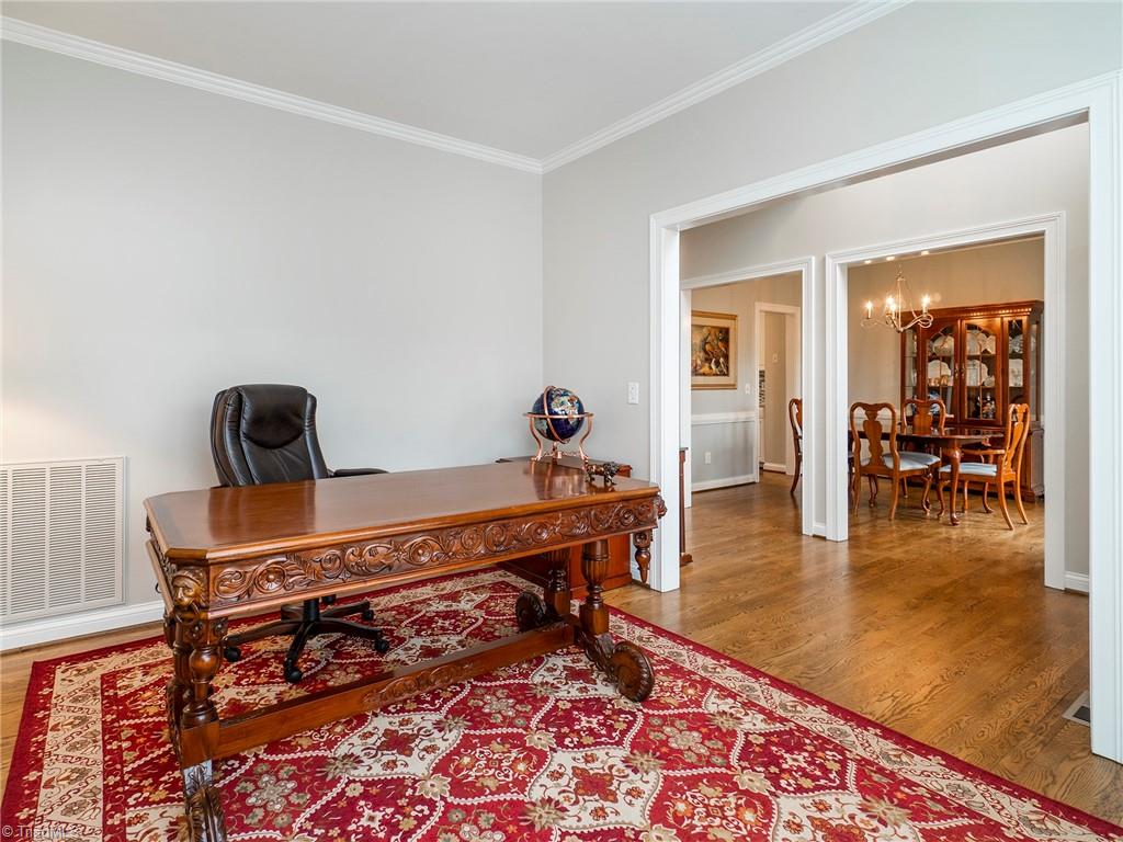 2811 Norwell Court Oak Ridge, NC 27310 - Photo 10 of 50 Formal living room being used as office space. This home offers two rooms that could be used for at home office space or school rooms perfect for anyone working or learning from home.