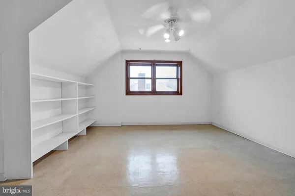 an empty room with a empty space and a window