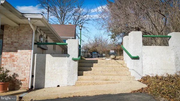 a view of a patio front of house