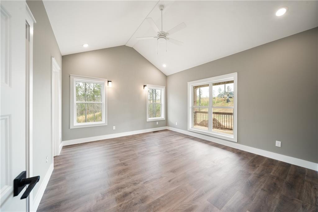 2956 Blalock Mountain Road Talking Rock, GA 30175 - Photo 18 of 65 a view of an empty room with wooden floor and a window