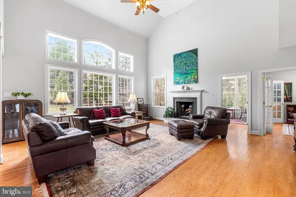 a living room with furniture windows and a fireplace