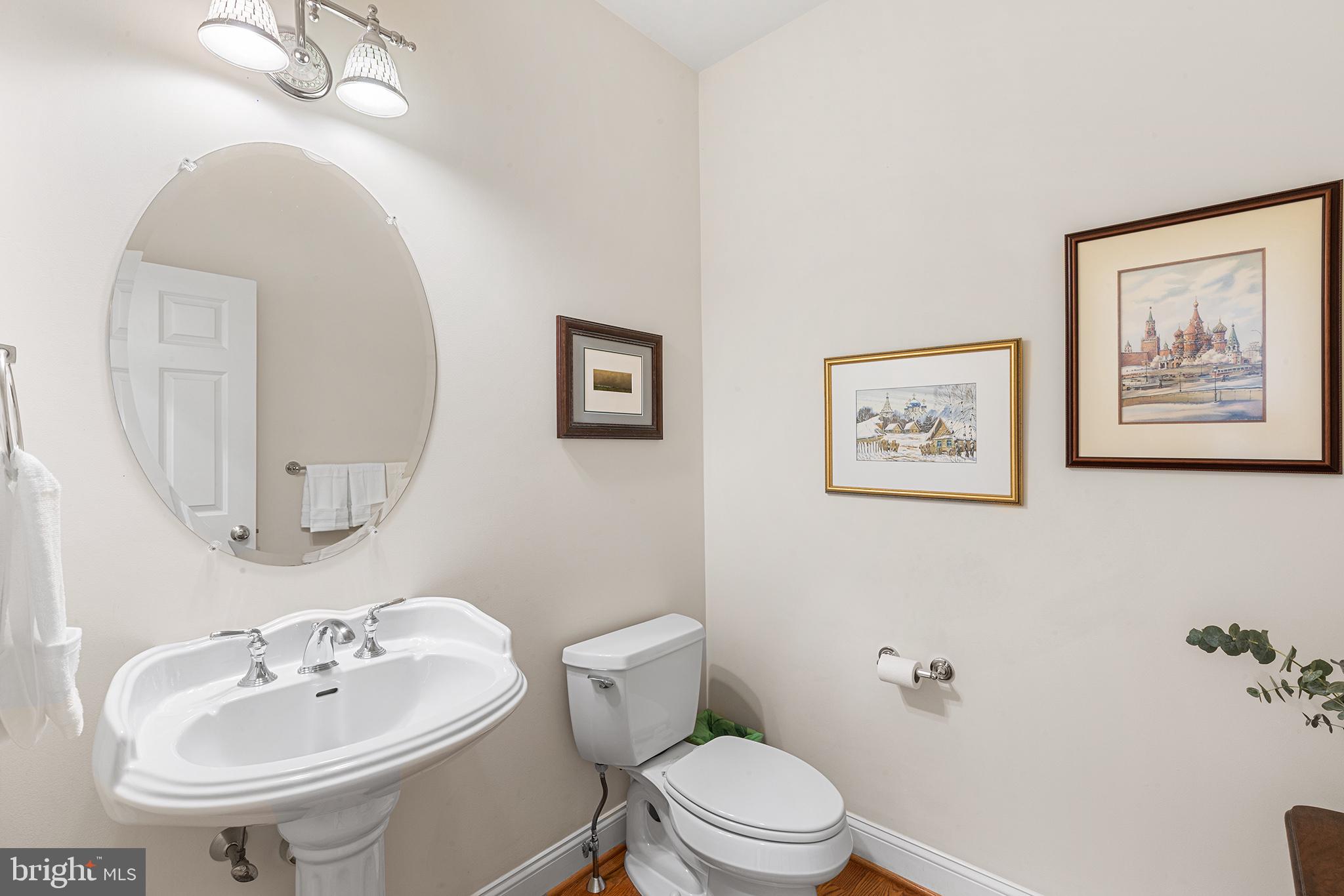 371 Trillium Lane Wayne, PA 19087 - Photo 23 of 43 a bathroom with a toilet a sink and mirror