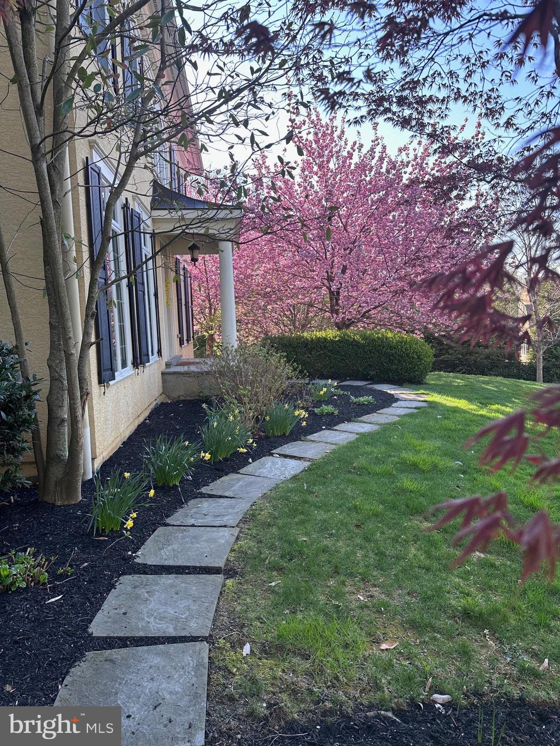 371 Trillium Lane Wayne, PA 19087 - Photo 3 of 43 a front view of a house with garden