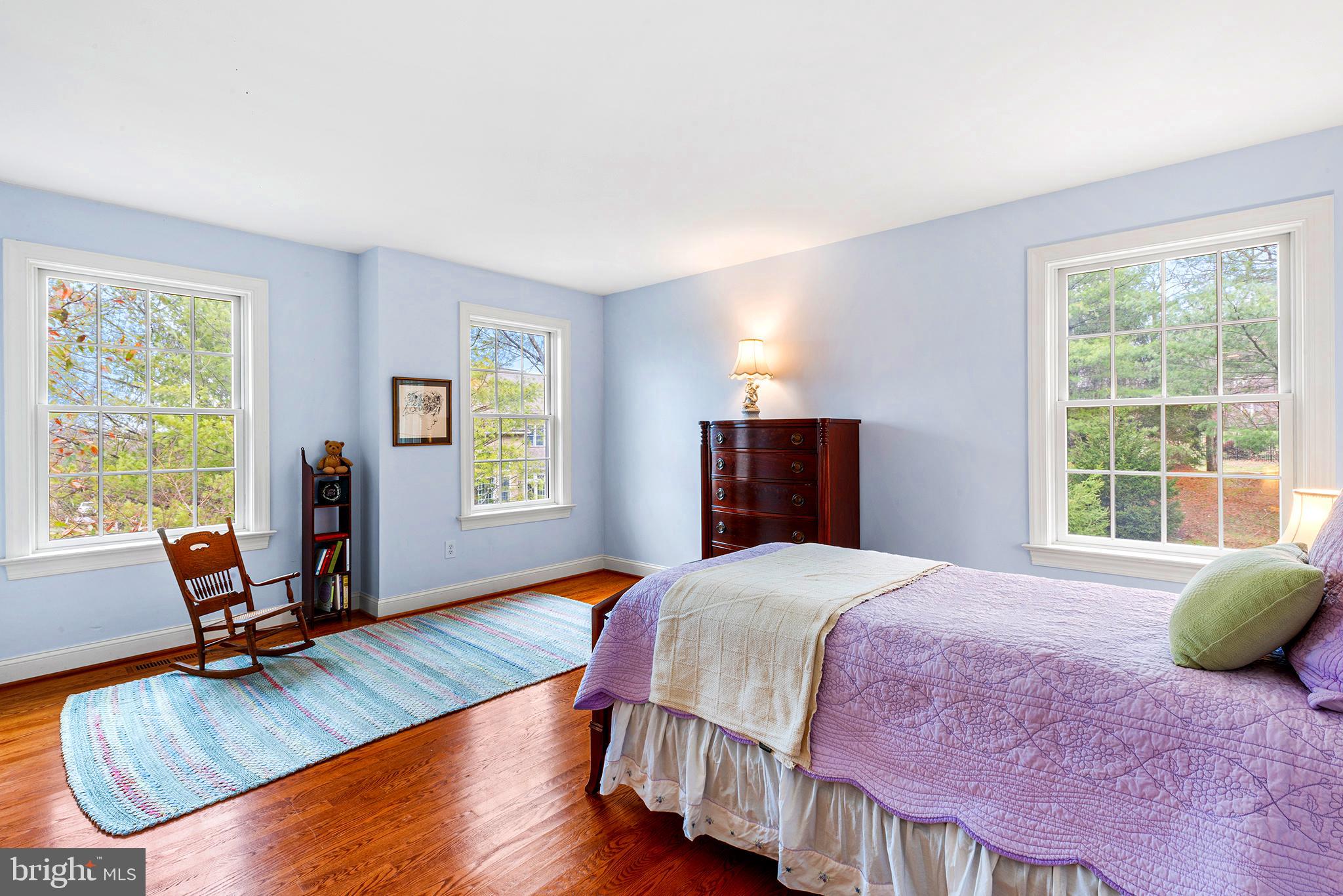 371 Trillium Lane Wayne, PA 19087 - Photo 35 of 43 a bedroom with a bed a large window and wooden floor